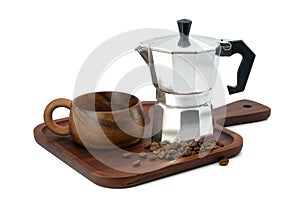 Moka Pot coffee maker with cup wooden and coffee beans on wooden tray