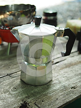 Moka pot coffee maker home drink small and good feel in garden and wooden table