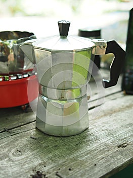 Moka pot coffee maker home drink small and good feel in garden and wooden table