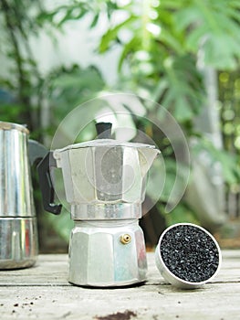 Moka pot coffee maker home drink small and good feel in garden and wooden table