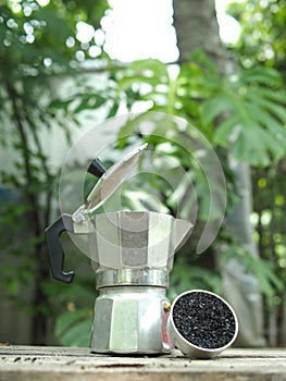 Moka pot coffee maker home drink small and good feel in garden and wooden table