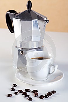 Moka pot and cup of espresso coffee photo
