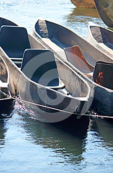 MOKORO BOATS TETHERED TO A ROPE ON THE RIVER