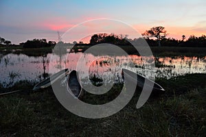 Mokoro in the Okavango delta at sunset, Botswana