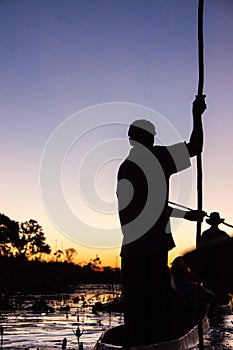 Mokoro Poler in Okavango Delta, Botswana