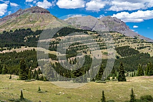 Molas Pass in Colorado along the Million Dollar Highway in the San Juan Mountains on a sunny summer day. Beautiful green mountain