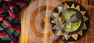 Molcajete Guacamole and Nachos panoramic table topview