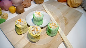 Mold clay create art activity of food is dim sum or Chinese Steamed Dumpling shrimp yellow and green