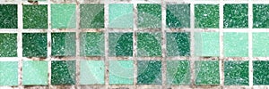 mold on joints between the ceramic tile in bathroom. old black toxic mildew dirt on the white seams of green mosaic tiles before c