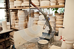 Mold sitting on a bench in a large pottery manufacturing workshop