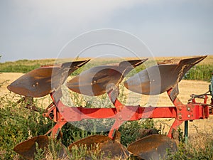 moldboard plow ready to cultivate the field. Ecology concept