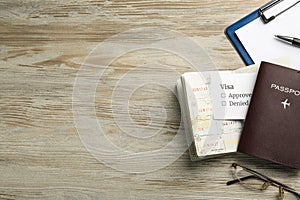 Moldova, Ceadir-Lunga - June 13, 2022: Flat lay composition with passports, pen and glasses on table. Space for text photo