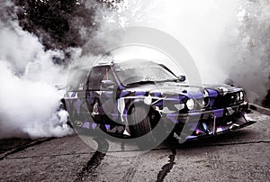 Moldova 25.09.2019. Sport modern Stance E30 BMW Car racing car drifting with smoke drift burnout, big clouds with