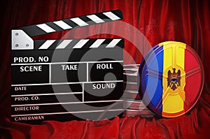 Moldovan cinematography, film industry, cinema in Moldova. Clapperboard with and film reels on the red fabric, 3D rendering