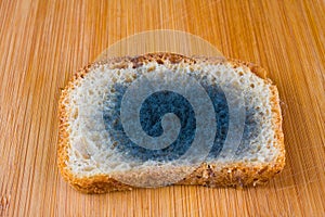 Moldy bread on a chopping board