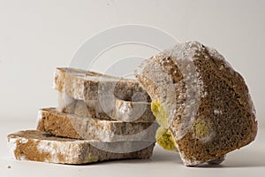 Moldy sliced Bread, close-up photo on a light background