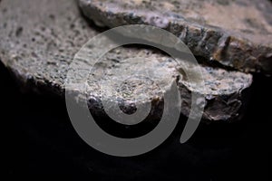Moldy white bread on a black background.