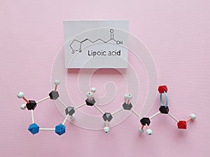 Molecular structure model and structural chemical formula of lipoic acid. Lipoic acid as a dietary supplement