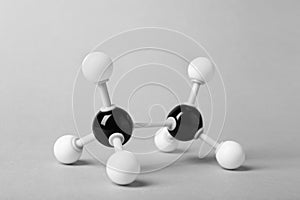 Molecule of alcohol on light grey background. Chemical model