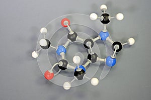 Molecule model of Caffein Coffein. White is Hydrogen, black is Carbon, red is Oxygen and blue is Nitrogen