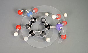 Molecule model of Roxarsone, a disputable ingredient in chicken food. Lilac is Arsen, blue is Ntrogen, black is carbon, Red is