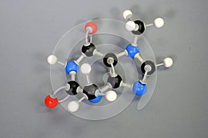 Molecule model of Theobromine, a major element in chocolate. White is Hydrogen, black is Carbon, red is Oxygen and blue is