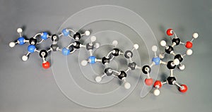 Molecule model of Vitamin B9. White is Hydrogen, black is Carbon, red is  Oxygen,  White is Hydrogen, black is Carbon, red is