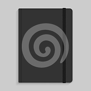 Moleskin notebook with black elastic band image. photo