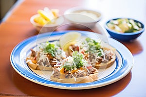 molletes with refried beans and cheese on openfaced rolls