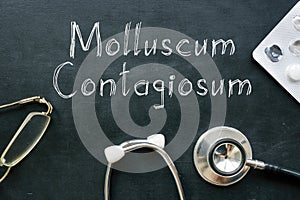 Molluscum contagiosum is shown on the medical photo using the text photo