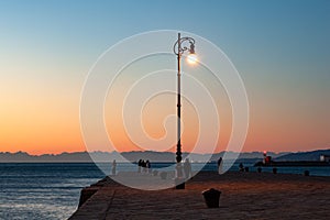 The Molo Audace pier of Trieste in a winter evening