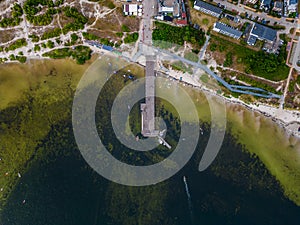 molo pier of Polish village Jastarnia, water of Baltic Sea, aerial drone view