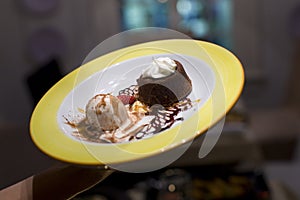 Molten chocolate lava cake with ice cream for dessert
