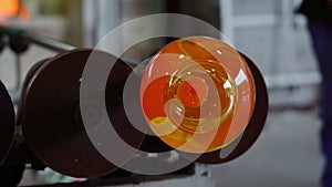 Molten glass on the barrel wheel in the factory