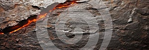 Molten lava flow within cracked volcanic rock surface showing heat and texture photo