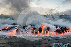 Molten lava flowing into the Pacific Ocean