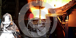 The molten metal is poured into the mold. Melting furnace for cast iron and steel and liquid