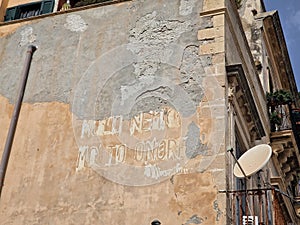 molti nemici molto onore english many enemies much honor benito mussolini fascism writing on building in siracuse, sicily, Italy