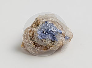 Molybdenite ore on white background.