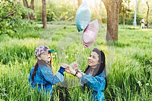 Mom andbeautiful girl on the lawn photo