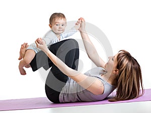 Mom with baby doing gymnastics and fitness exercises