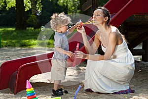 Mom and boy making bubbles