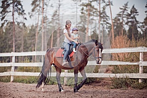 Mom and child on the horse