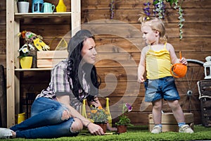 Mom and child are planting flowers