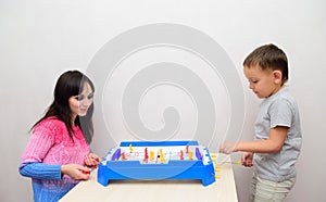 Mom with a child playing a board game