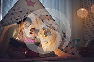 Mom and child are reading book