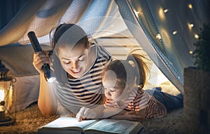 Mom and child reading book photo