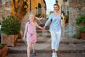 Mom and child tourists in Tuscany, Italy having excursion