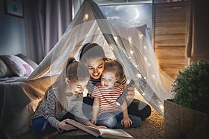 Mom and children reading book