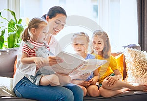 Mom and children reading a book